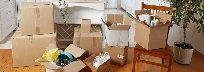 Packed moving boxes and household items in a kitchen before move-out or move-in cleaning, Tampa, FL.